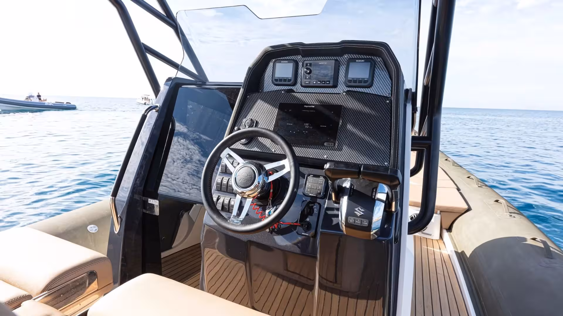 Steering console of a dinghy showcasing modern navigation equipment, ideal for exploring La Maddalena's beaches.