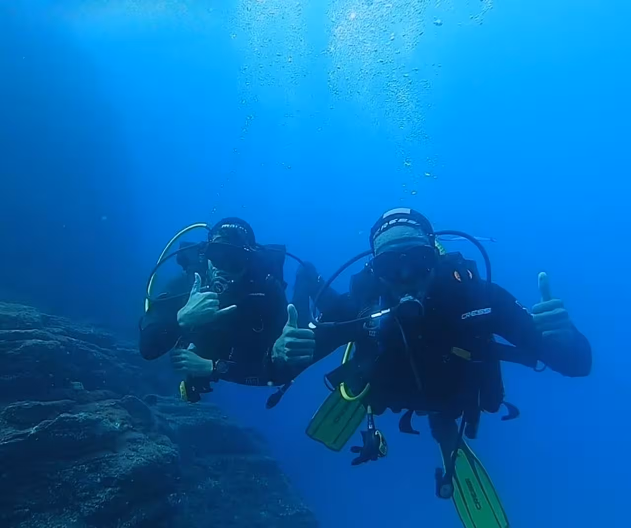 Two divers practice skills during Divemaster certification dives in São Miguel, Azores, giving OK underwater