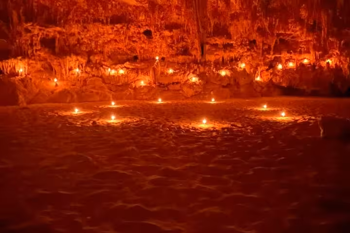 Candlelit Djara Cave chamber during 3-day White Desert and Black Desert desert camping adventure