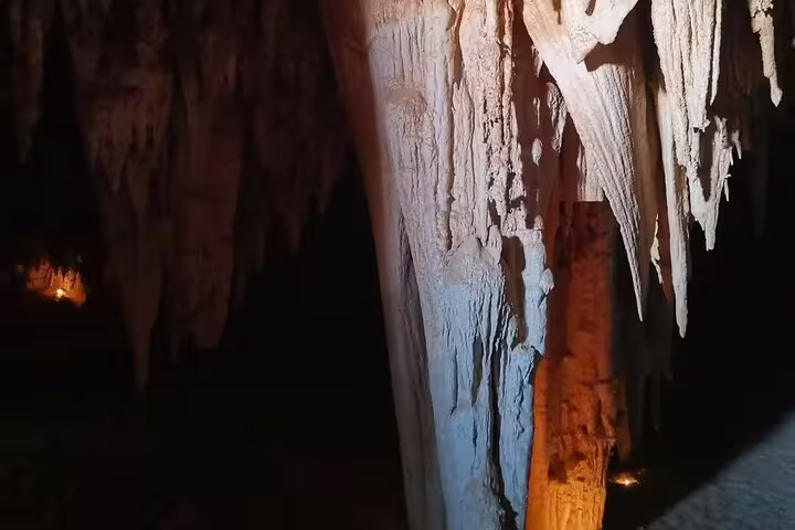 Close-up of Djara Cave stalactites and calcite columns, must-see stop on Black and White Desert package