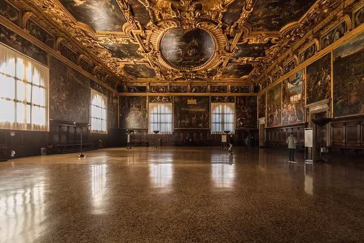 Experience the grandeur of Doge's Palace's opulent hall with its ornate ceilings on our skip-the-line entry tour.