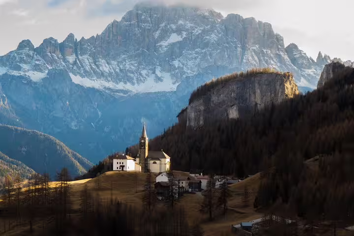 Scenic view of a picturesque village nestled in the Dolomites, perfect for a private day trip from Venice.