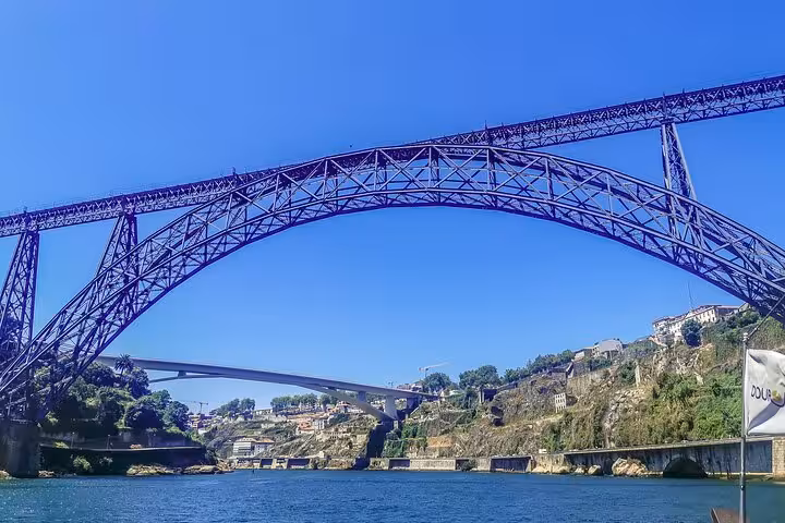 Dom Luís I Bridge over the Douro River in Porto, scenic stop on Three Shrines Pilgrimage Fátima Santiago Nazaré