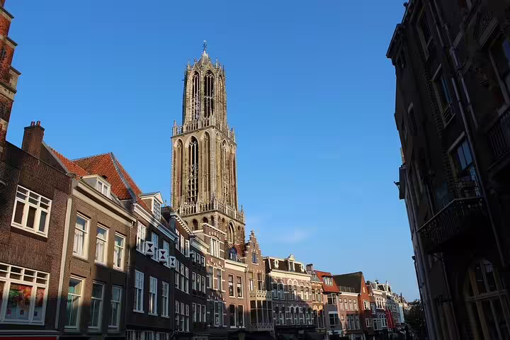 Dom Tower rising over Utrecht old town, must-see landmark on a private day trip from Amsterdam with local guide