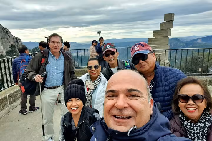 Happy travelers at scenic viewpoint on Dublin to Blarney Castle, Cork City and historic Rock of Cashel tour