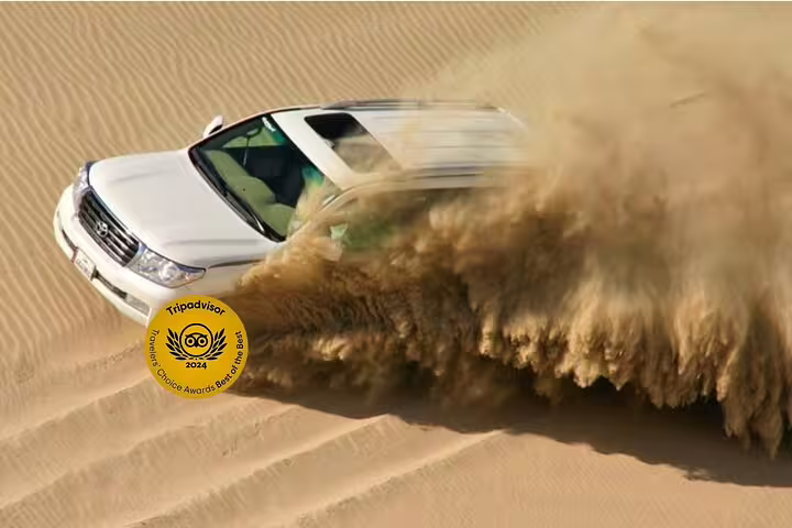 Thrilling dune bashing adventure with a 4x4 SUV kicking up sand in the desert, perfect for adrenaline seekers.