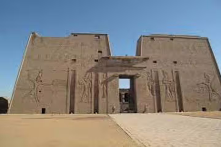 Edfu Temple entrance near Luxor, ancient Egyptian carvings on pylons on Abu Simbel day tour route