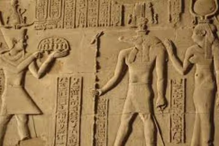 Ancient Egyptian wall relief and hieroglyphs at Edfu Temple, visited on Luxor to Abu Simbel tour