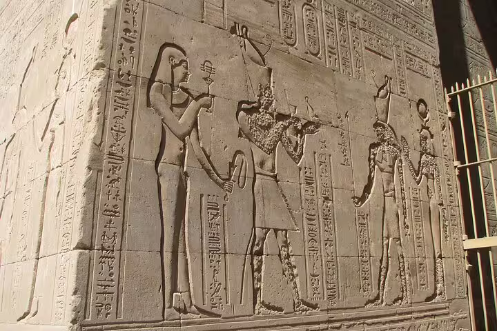 Close-up of Edfu Temple wall reliefs and hieroglyphs, guided Luxor day trip to Edfu and Kom Ombo temples