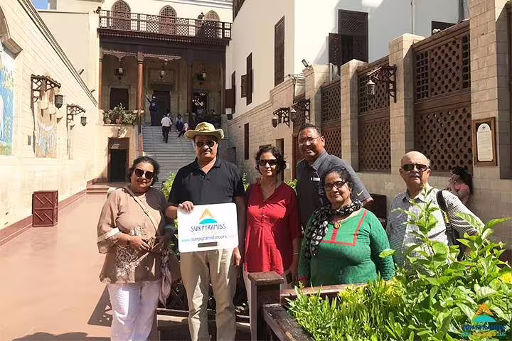 Travel group at historic Cairo courtyard on 8 days 7 nights Jewels of Egypt Luxor and Aswan guided tour