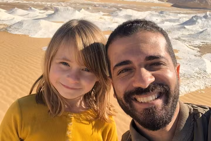 Traveler selfie in Egypt White Desert with chalk hills, memorable moment on 3-day desert camping tour to Bahariya