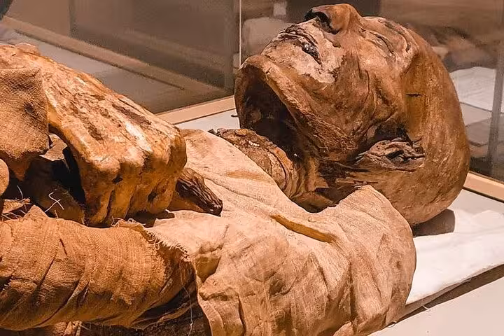 Ancient Egyptian mummy exhibit at the Egyptian Museum, featured on the Museum Citadel and Khan El Khalili tour
