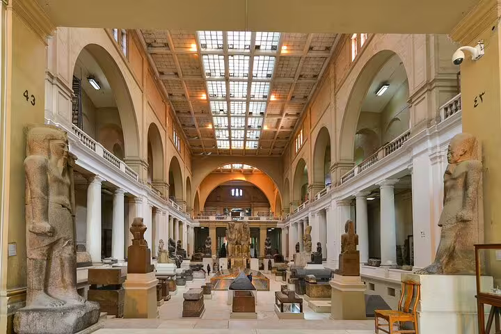 Egyptian Museum Cairo grand hall with ancient statues on a private Port Said shore excursion day tour