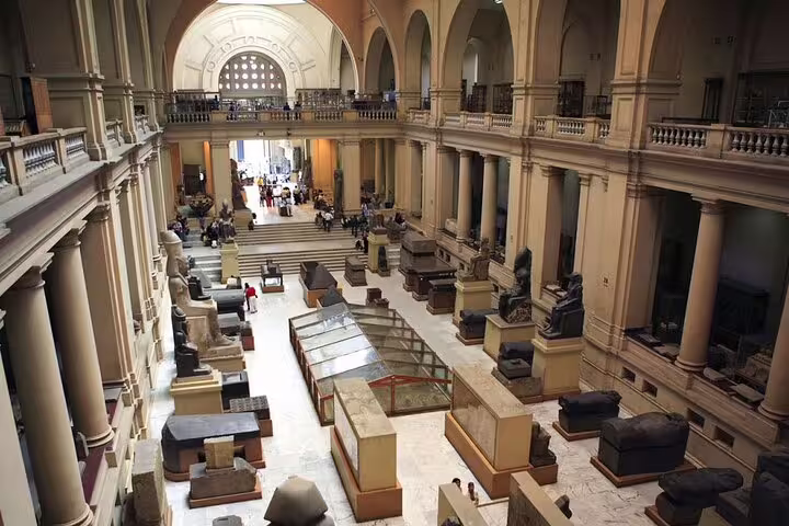 Inside Egyptian Museum Cairo gallery with ancient artifacts on Hurghada to Pyramids of Giza and Cairo minivan tour