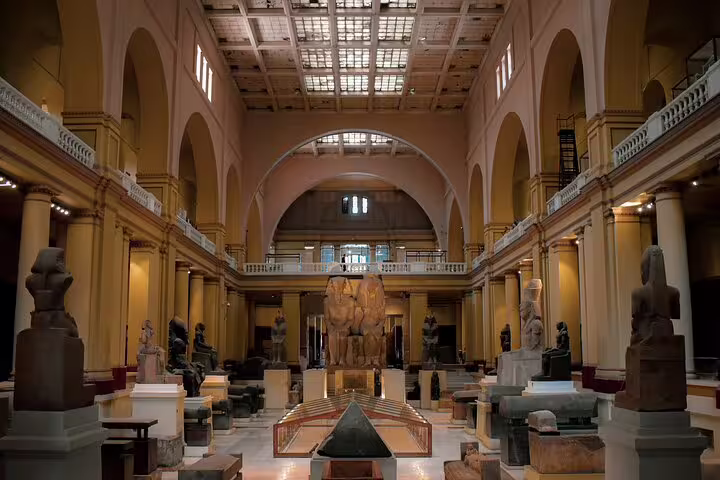 Grand hall of the Egyptian Museum Cairo with statues and artifacts on a private guided museum tour