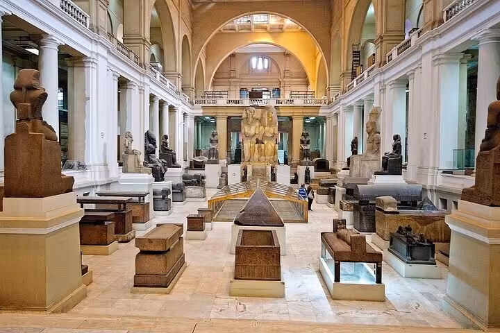 Grand hall inside the Egyptian Museum Cairo with pharaonic statues on a private Cairo day tour