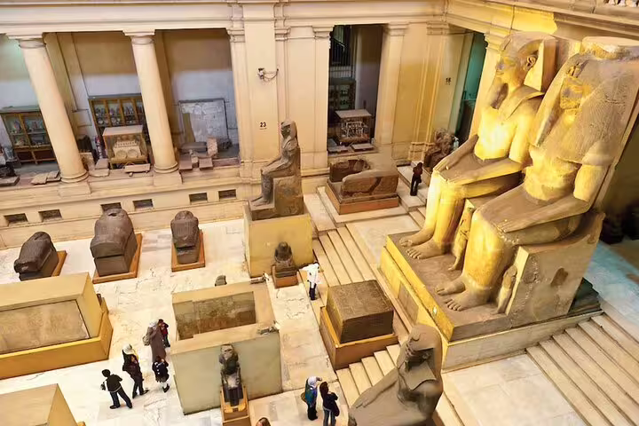 Colossal seated statues inside the Egyptian Museum Cairo, highlight of Port Said private Giza Pyramids day tour