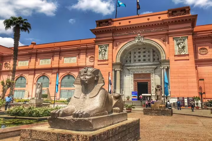 Egyptian Museum Cairo entrance with sphinx statue, included on 2-day Port Said tour to Pyramids and Old Cairo