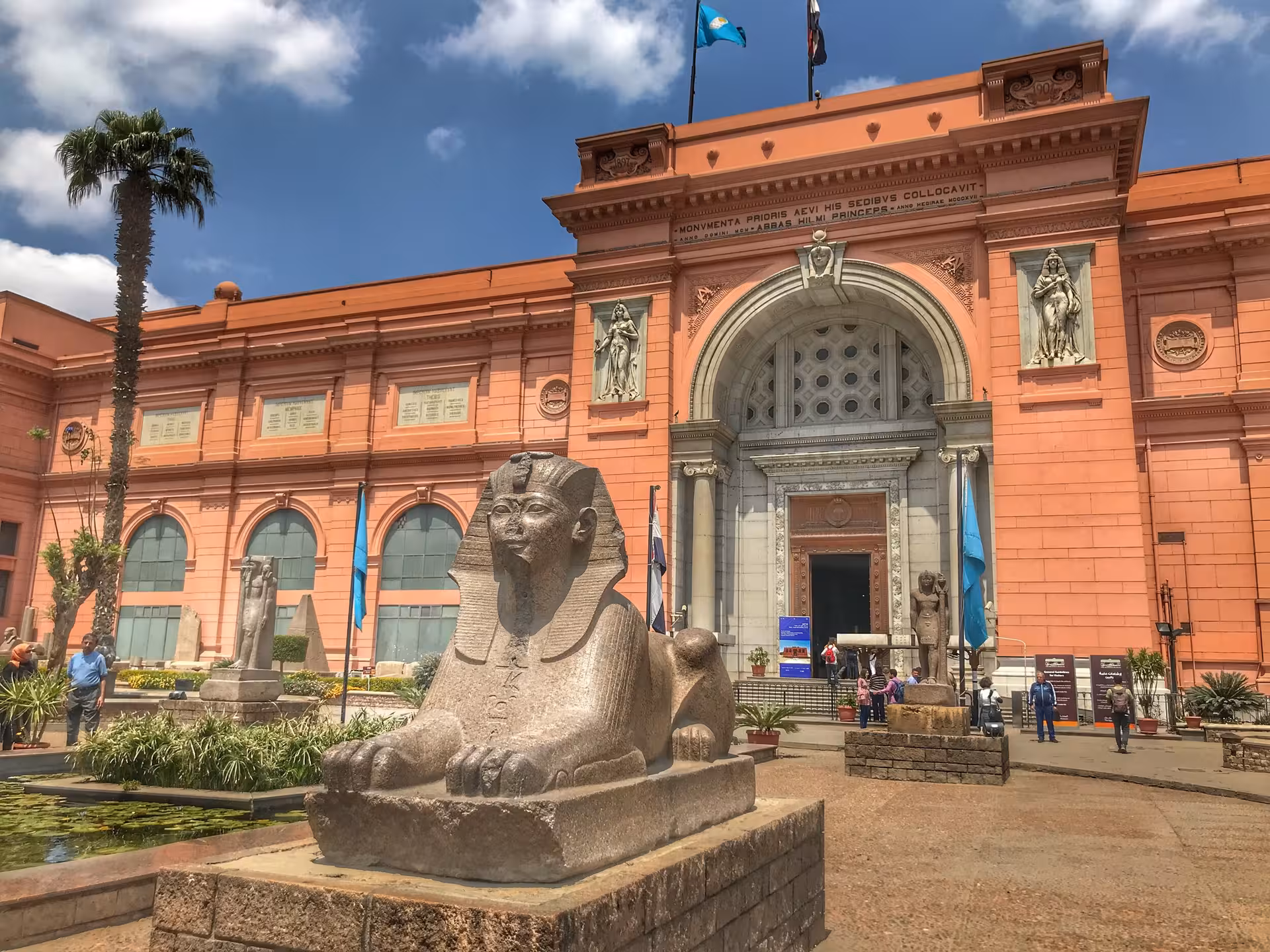 Egyptian Museum Cairo entrance with sphinx statue, highlight on private full-day Giza tour itinerary