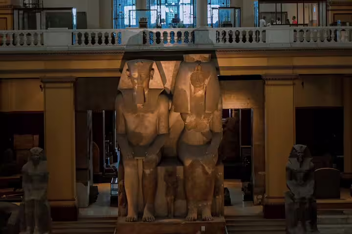 Colossal seated statues in the Egyptian Museum Cairo, highlight stop on a private guided museum tour