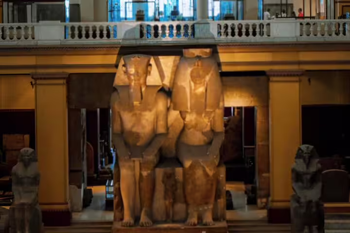Ancient Egyptian pharaoh statues inside the Egyptian Museum Cairo on a private Alexandria Port day trip