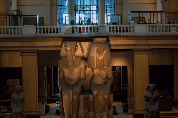 Colossal pharaoh statues inside the Egyptian Museum Cairo, highlight stop on Alexandria to Cairo day tour