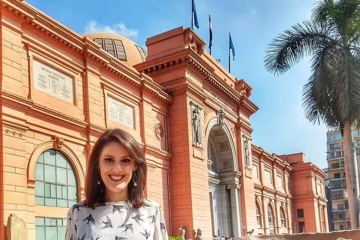 Private guided 4-hour day tour at the Egyptian Museum Cairo, traveler posing by the historic entrance