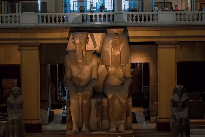 Colossal ancient Egyptian statues inside the Egyptian Museum Cairo, highlight of Giza Pyramids day tour