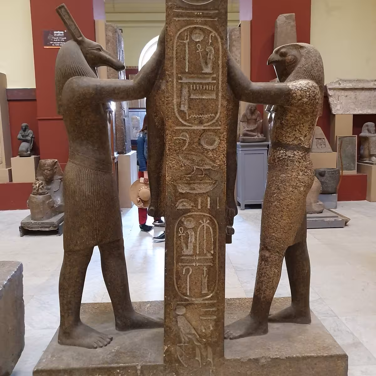 Ancient Egyptian statues with hieroglyphs inside Cairo Egyptian Museum on private guided tour