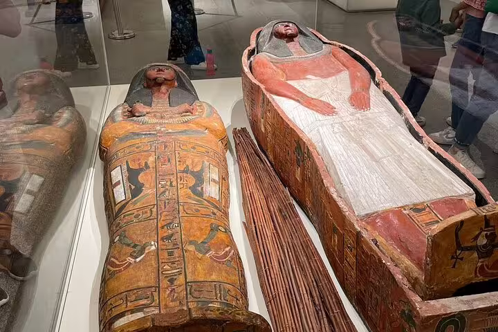 Painted ancient Egyptian sarcophagi on display, seen on private guided tour of NMEC and the Egyptian Museum Cairo