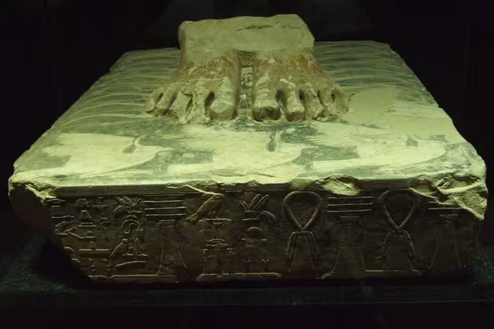 Ancient Egyptian carved sarcophagus lid with hieroglyphs at Memphis Museum, Saqqara tour with lunch