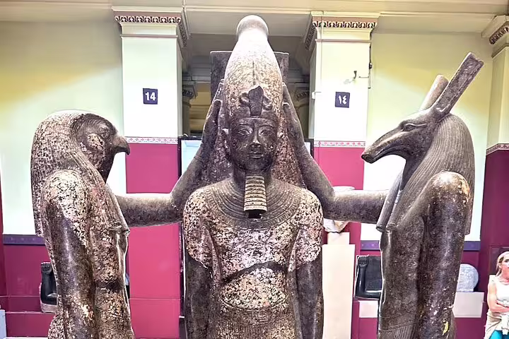 Ancient Egyptian triad statue inside the Egyptian Museum Cairo, highlight of the Giza Pyramids day tour itinerary