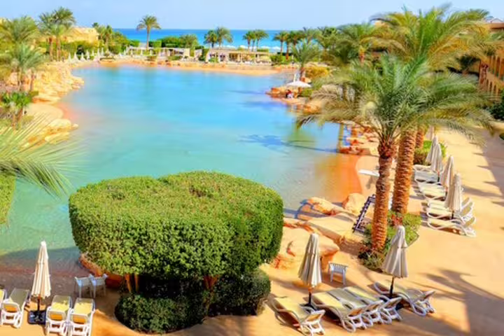 El Ain Sokhna lagoon beach resort with palm trees and loungers, private overnight trip from Cairo