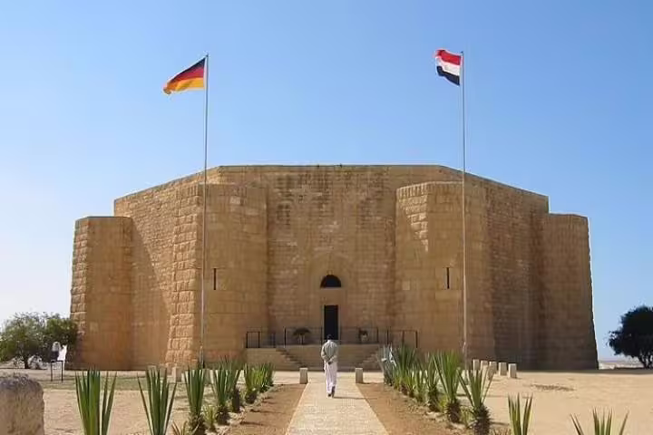 El Alamein German War Memorial with Egypt and Germany flags, highlight of El-Alamein day trip from Cairo