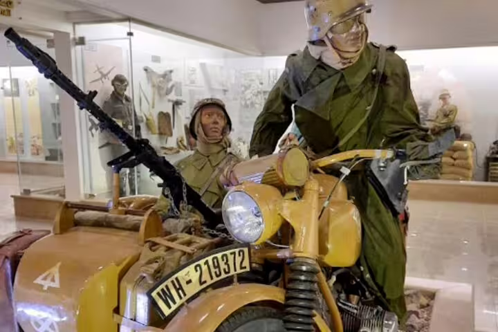 World War II motorcycle and soldier mannequins at El Alamein Military Museum on day tour from Cairo