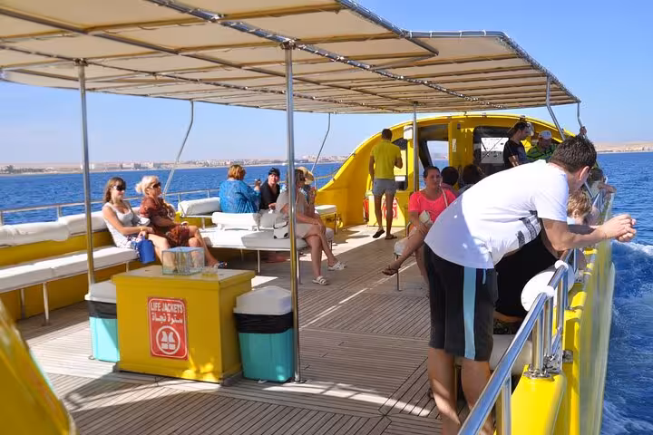 Passengers relaxing on the deck of El Gouna semi submarine boat departing Abu Tig Marina for Red Sea tour
