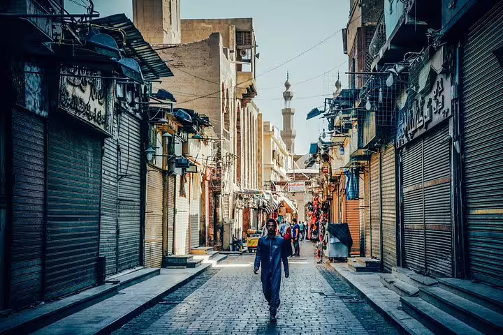 El-Moez Street Cairo bazaar alley with minaret view, part of Giza Pyramids, Memphis and Dahshur tour