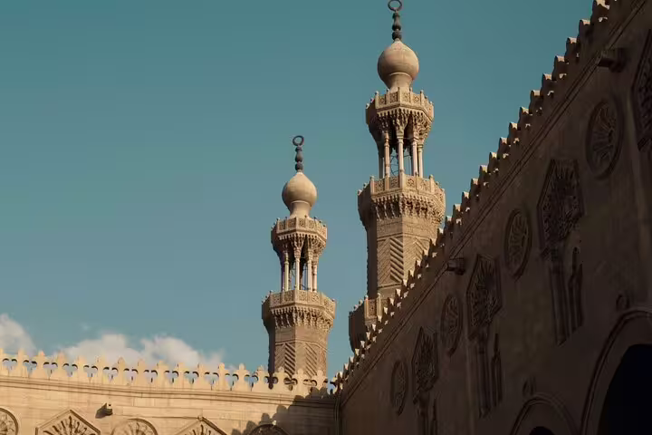 Ornate Islamic Cairo facade with Arabic calligraphy and arched windows on El-Muizz Street tour with dinner
