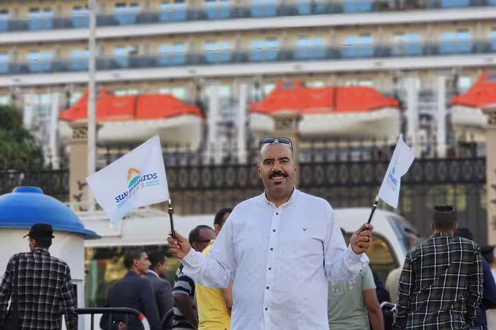 Tour guide welcomes guests at El Sokhna Port for Giza Pyramids tour and Nile lunch cruise transfer