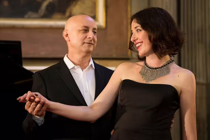 Elegant couple performing duet at New Year's Eve Opera Gala 31 December, romantic opera celebration in historic venue