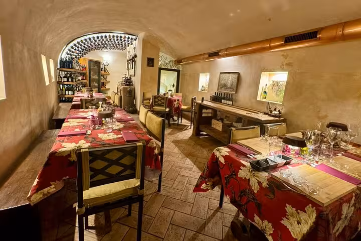 Charming enogastronomy dining room with elegant tables set for a wine and food tasting experience.