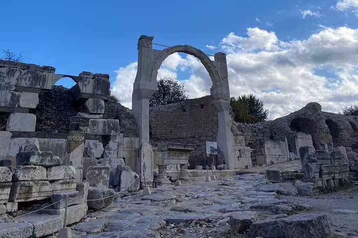 Ancient stone archway and ruins in Ephesus on a private half-day tour with on-time return to Kusadasi