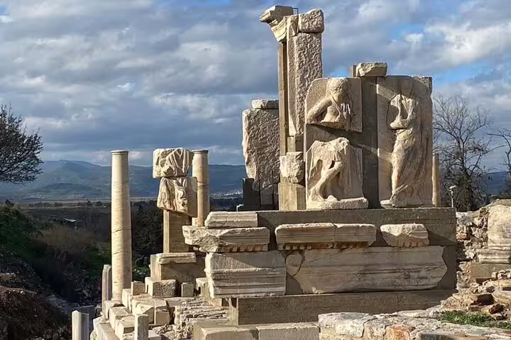 Ephesus ancient ruins with carved stone reliefs, private half day tour from Kusadasi with on-time return