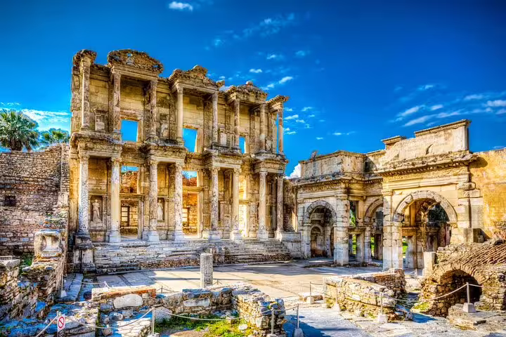 Discover the well-preserved ruins of the Celsus Library under clear blue skies on your Ephesus tour from Selcuk.