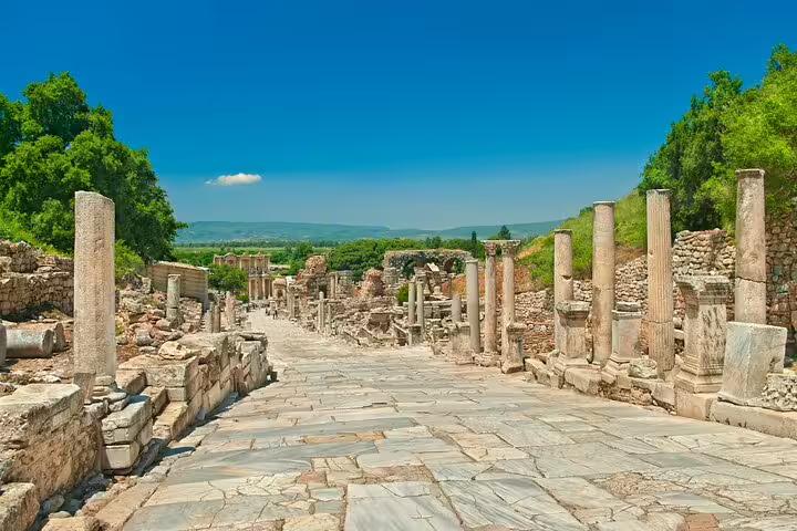 Walk along the stunning Curetes Street in Ephesus, lined with ancient columns and ruins on a private guided tour.