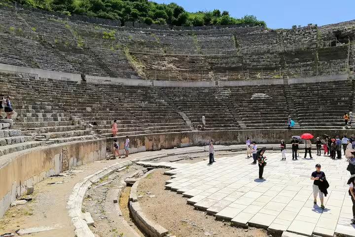 Grand Theatre of Ephesus with visitors on all-inclusive private Ephesus day trip from Istanbul with return flights