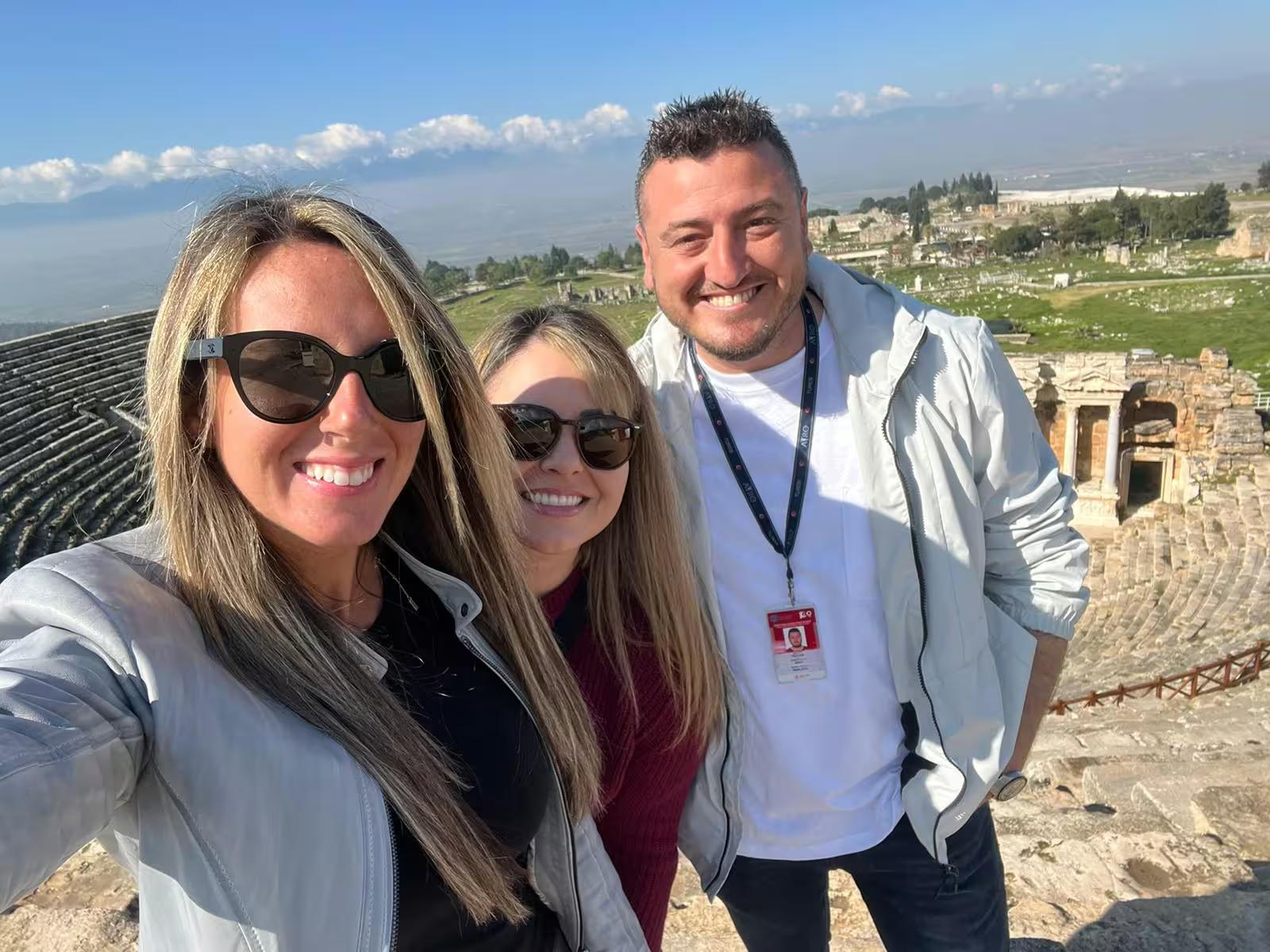 Guests selfie with guide at Ephesus Great Theatre viewpoint on a private panoramic Ephesus tour