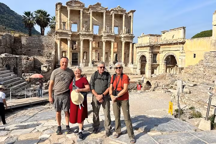 Cruise guests pose at the Library of Celsus on an Ephesus shore excursion tour with lunch in Turkey