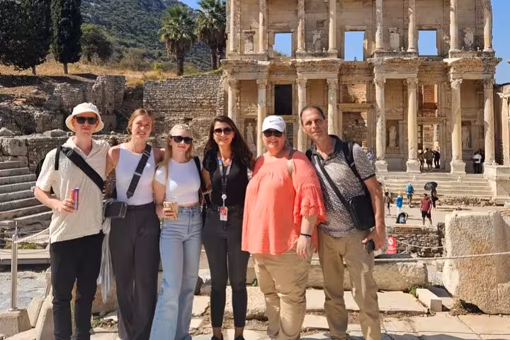 Cruise guests pose at Ephesus Library of Celsus on Kusadasi shore excursion private or group tour