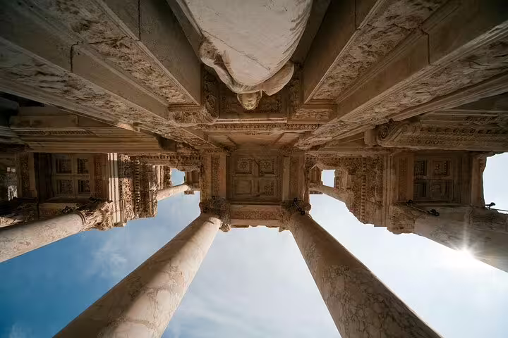 Upward view of Ephesus marble columns and ornate ceiling, part of an Izmir Cruise Port shore tour
